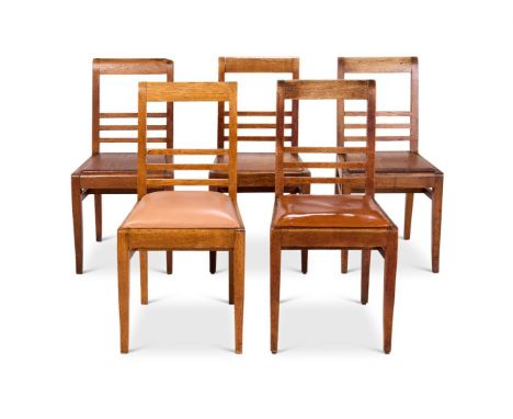 A PAIR OF OAK AND LEATHER UPHOLSTERED SIDE CHAIRS  FRENCH, CIRCA 1950, DESIGNED FOR THE CITÉ UNIVERSITAIRE OF PARIS  Each 86c