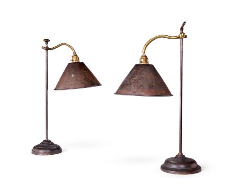 A NEAR PAIR OF STEEL AND IRON DESK LAMPS WITH METAL SHADES   FRENCH, CIRCA 1900  Slight variances to base and finial designs 