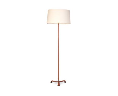 JACQUES ADNET (FRENCH, 1900-1984) A FLOOR LAMP; CIRCA 1950 With leather-covered tripod base and cream paper shade 140cm high 