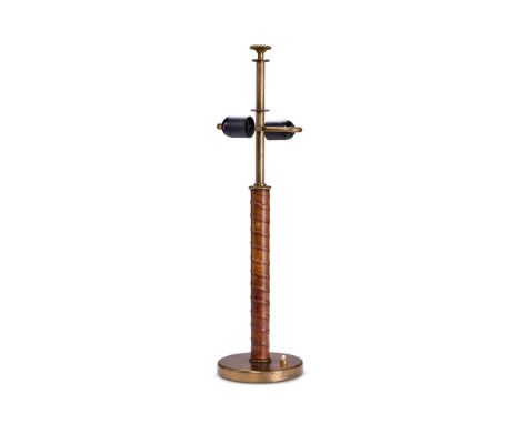 LISA JOHANSSON-PAPE (FINNISH, 1907-1989) A TABLE LAMP; CIRCA 1950 brass and leather  60cm high    Provenance:   Acquired from