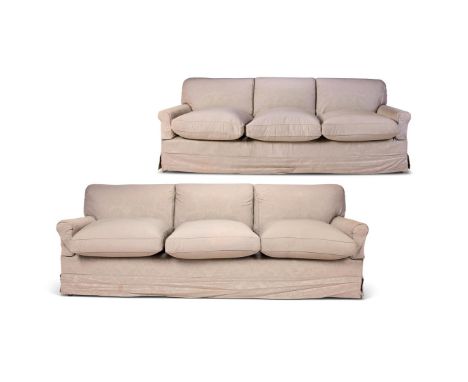 A PAIR OF UPHOLSTERED THREE SEAT SOFAS  MODERN, BY HOWARD CHAIRS LTD  The grey loose covers over modern green H&S ticking  Wi