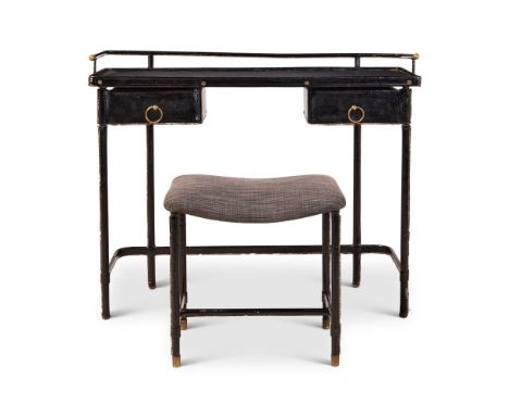 JACQUES ADNET (FRENCH, 1900-1984) A DESK AND STOOL; CIRCA 1930  Metal frames covered in black leather. Desk with two pivoting