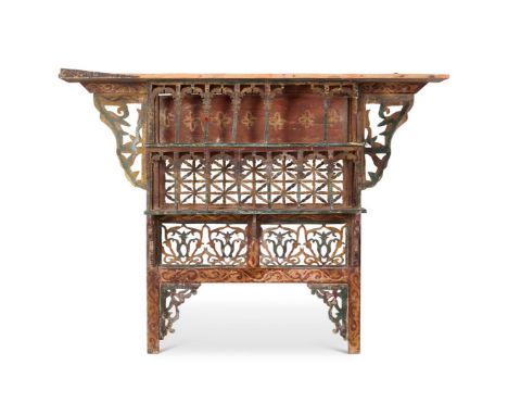 A PAINTED HANGING SHELF MOROCCAN, EARLY 20TH CENTURY With arcaded supports and spandrels  46cm high, 66cm wide, 22cm deep   S