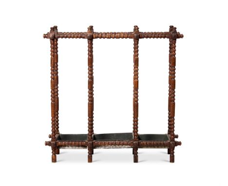 AN OAK RING-TURNED THREE-DIVISION STICK STAND 20TH CENTURY   76cm high, 78cm wide, 28cm deep        Condition Report:  Good, 