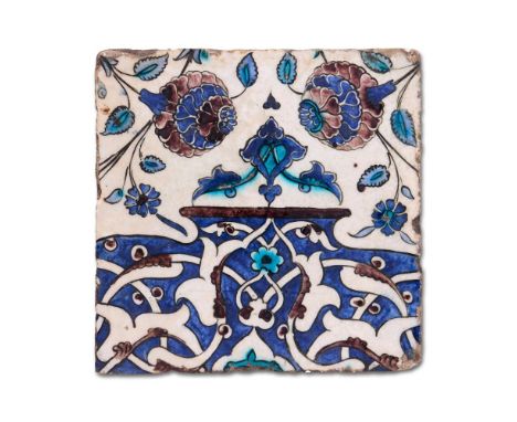 A DAMASCUS POTTERY TILE, OTTOMAN, SYRIA CIRCA 1600 23cm high,23cm wide     Provenance:   Acquired from Simon Ray, London     
