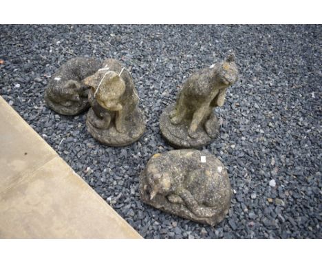 Four reconstituted garden ornaments, cat interest