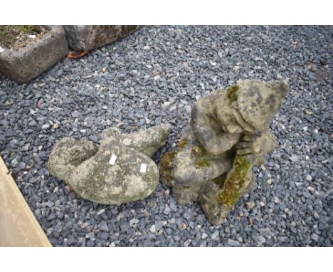 Two reconstituted garden ornaments, sleeping cherbub and elf/goblin interest