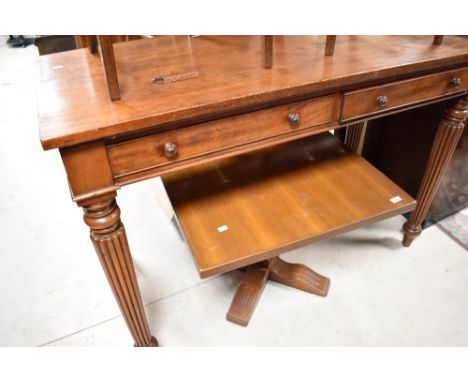 A 19th Century mahogany Regency design buffet/side table having two drawers and reeded tapering legs in the Gillows style, wi