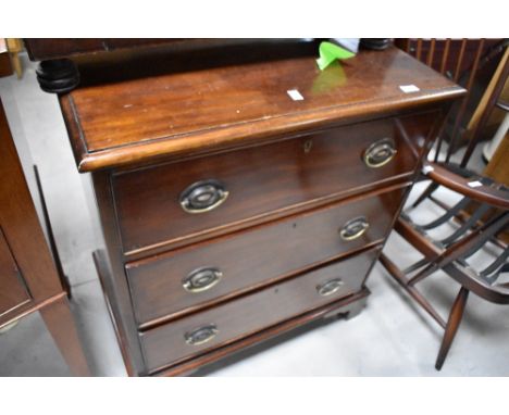 A 19th Century mahogany chest of three long drawers, having Regency style handles and bracket feet, width approx. 71cm
