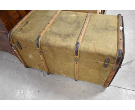 A vintage canvas covered travel trunk, labelled Albion , width approx. 83cm