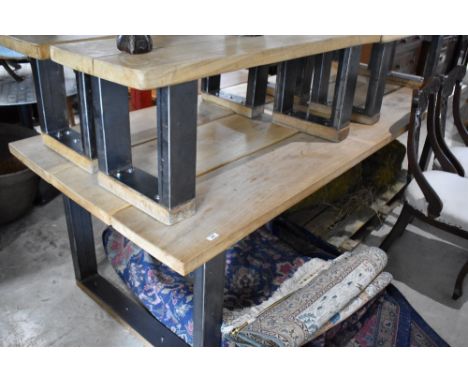 A large three plank oak and steel framed dining table, along with four similar bench seats, suitable for inside or outside, a