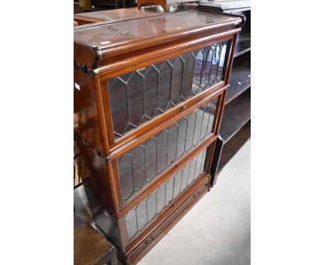 A late 19th or early 20th Century Globe Wernicke three tier stacking bookcase on drawer base, width approx. 87cm