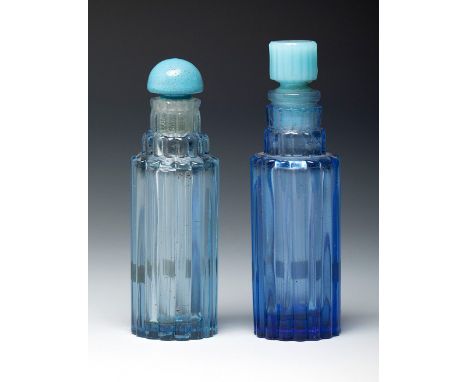 RENÉ LALIQUE (Ay, France, 1860- Paris, 1945).Two Worth "Je reviens" bottles, ca. 1940.Blue moulded glass.Work reproduced in "