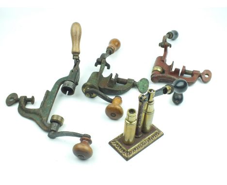 Three 12-bore bench mounted roll turnover reloading tools, together with a JAMES DIXON capper decapper, latter lacking pin. (