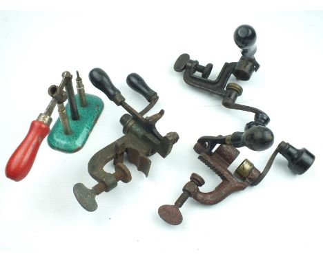 Three 12-bore bench mounted roll turnover reloading tools, together with a capper decapper. (4)