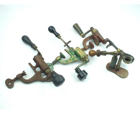 Three bench mounted roll turnover reloading tools, one by Hawksley, together with a capper decapper. (4)