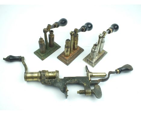 Three capper decapper reloading tools, together with a bench mounted NIMROD reloading tool. (4)