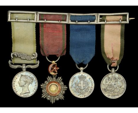 The mounted group of four miniature dress medals attributed to Major E. J. Ward-Ashton, Royal Artillery, who was recommended 