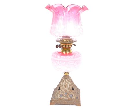 Fidelitas - A 20th century cast metal and floral decorated opaline glass oil lamp by Fidelitas, Austria. The reservoir having