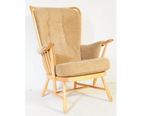 Ercol Furniture - A vintage mid 20th century blonde beech and elm conservatory armchair. Having a high spindle back with stra