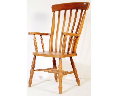 A vintage 20th century Victorian style Windsor beech and elm kitchen armchair. Having a curved stop, flat slatted back rest o