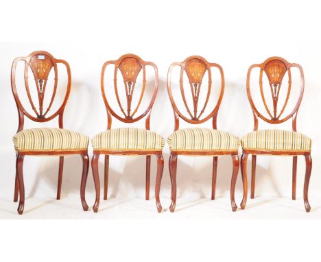 A matching group of four vintage 20th century Edwardian style dining chairs. Mahogany construction with inlaid decoration. Wi