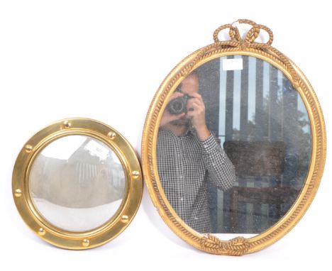 An early 20th century marine brass port hole wall hanging mirror, together with another example with frame being in the form 