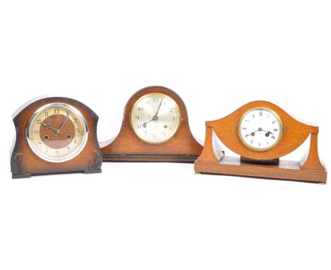 A collection of three 20th century clocks to include an Edwardian mantel clock with enamelled face in solid oak inlaid case w