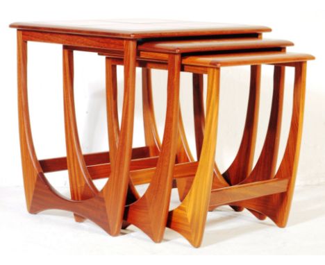 G-Plan Furniture - A 1970's G-Plan ' Astro ' teak wood nest of tables. The tables of graduating form with each being united b