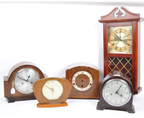 An assortment of 20th century to include two oak veneer mantel clocks with one being marked for Enfield, an Art Deco Bakelite