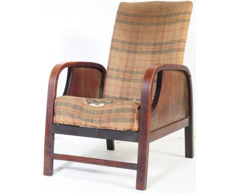 A vintage 20th century circa 1930s Art Deco reclining armchair. Having a square chequered pattern upholstery back rest and cu