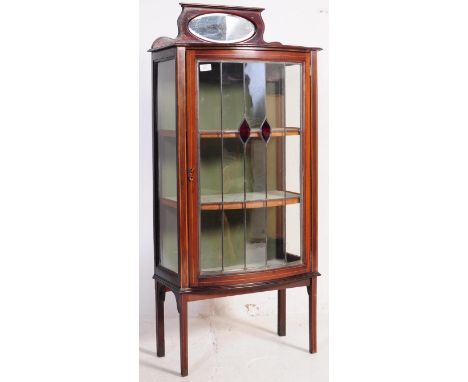 An Edwardian circa 1900s mahogany inlaid China display cabinet with full length door housing shelves set within, the top with