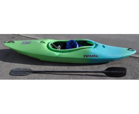 A Pyranha G:3 kayak / canoe 275&nbsp; G series. Together with a kloo double oar / paddle and NKE splash skirt. Measures appro