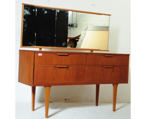British Modern Design - Teak wood mid century dressing table chest of drawers. Raised on tapering legs with wide body having 