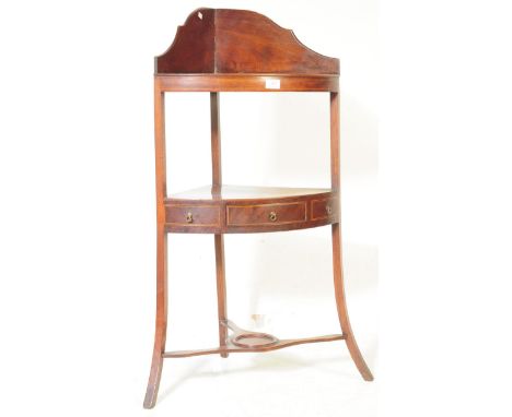 A 19th century George III mahogany inlaid washstand.&nbsp;Above, the arched gallery back with shelf and&nbsp;lower triangular