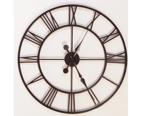 A large contemporary garden outdoor hanging wall clock. Circular ebonised tubular construction with Roman numeral chapter rin