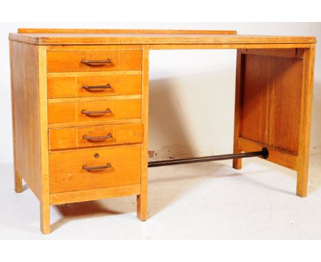 Lebus - A retro mid 20th century circa 1950's Lebus oak school writing table desk. Of rectangular form with small gallery bac