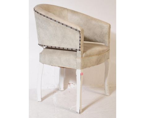 A mid 20th century vintage circa 1940s tub chair. Having a circular back with grey fabric. Swivel movement and splayed legs. 