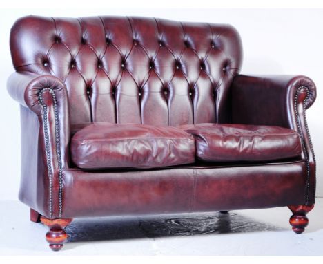 British Modern Design - A Thomas Lloyd leather Chesterfield style 2 seat sofa settee. The sofa with Brown leather button back