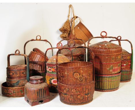 A collection of approximately eleven 20th century vintage woven wicker Chinese wedding baskets / food carriers to include exa