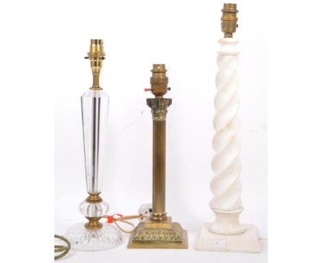 A collection of three mid to late 20th Century lamp stands. One brass with column features, raised on a plinth base, second b