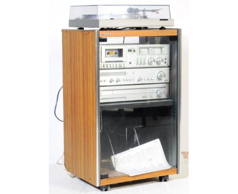 A retro mid 20th century teak and glass record music media cabinet. With retro Panasonic hi-fi system to include Amp, Radio T