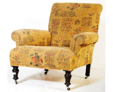 A vintage 20th century Howard &amp; Sons style fireside armchair. With a rectangular padded cushioned backrest. Into large cu