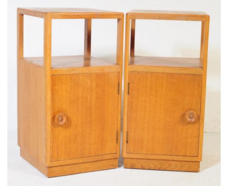 A pair of retro vintage late 20th century plywood bedside cabinets having open upper, above cupboards storage space, with bra