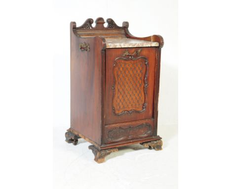 A 19th century Victorian Chinese Chippendale style mahogany coal purdonium. The coal scuttle having crested gallery back with