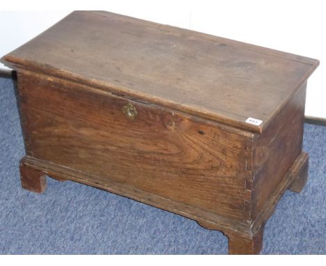 A Georgian elm chest raised on bracket feet, 66cm wide 
