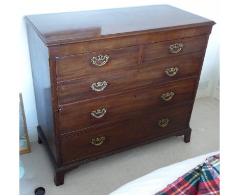 An 18th Century mahogany chest; thumbnail moulded top above a frieze, two half-width and three full-width graduated drawers w