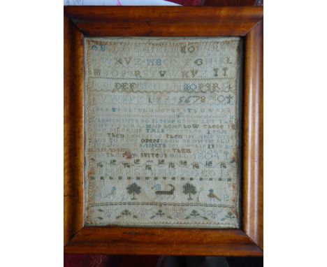 An early/mid 19th century maple-framed and glazed sampler with alphabet, numerals, various verse etc. above stylised animals,