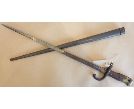 A French Model 1874 Gras Bayonet with matching scabbard (serial no. 86350), light surface corrosion to scabbard and damage to