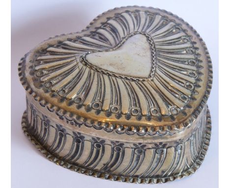 A 19th century hallmarked silver heart-shaped trinket box and cover; gilded interior, heart-shaped vacant cartouche; assayed 